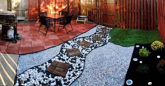 Landscape lighting illuminating storefront gardens at dus